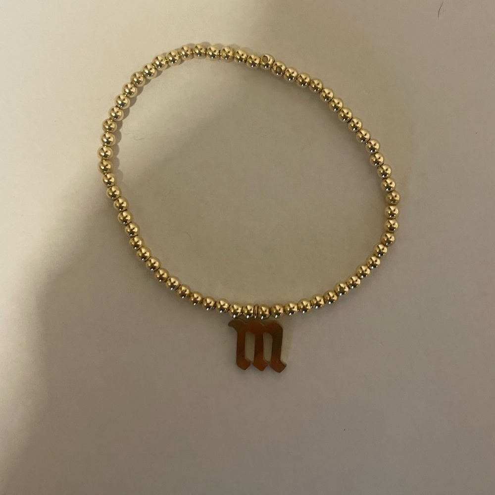Gold gothic letter M bead stretch bracelet​​​​​​​​